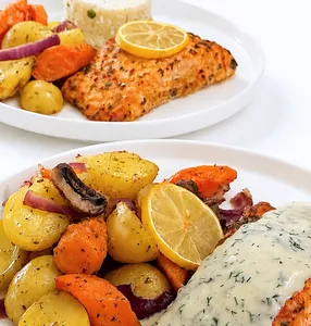 Salmon with dill sauce, potatoes, vegetables, and rice